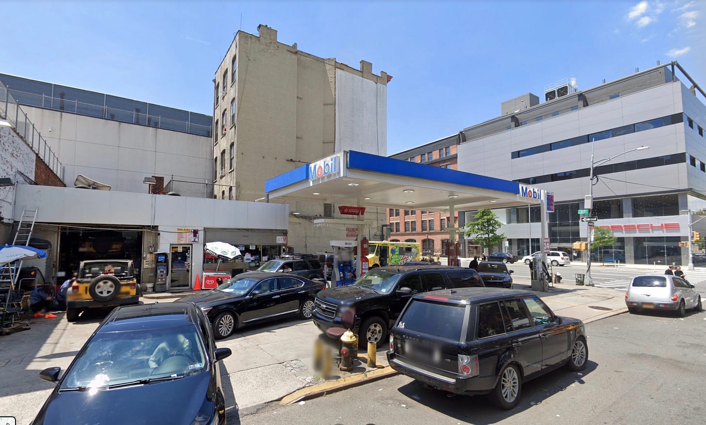 A picture containing text, outdoor, sky, building

Description automatically generated