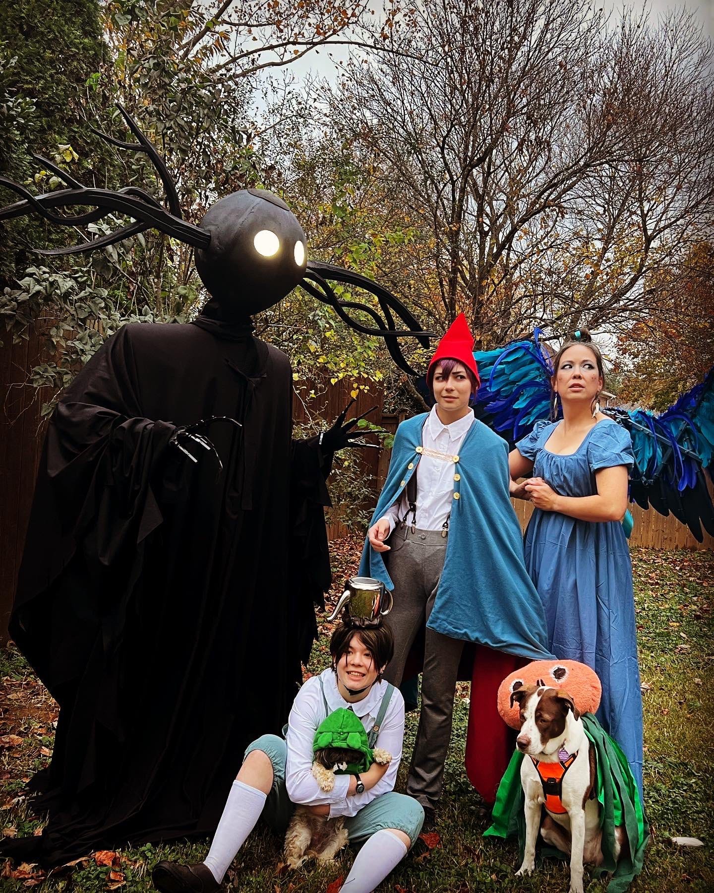A family dressed as characters from Over the Garden Wall