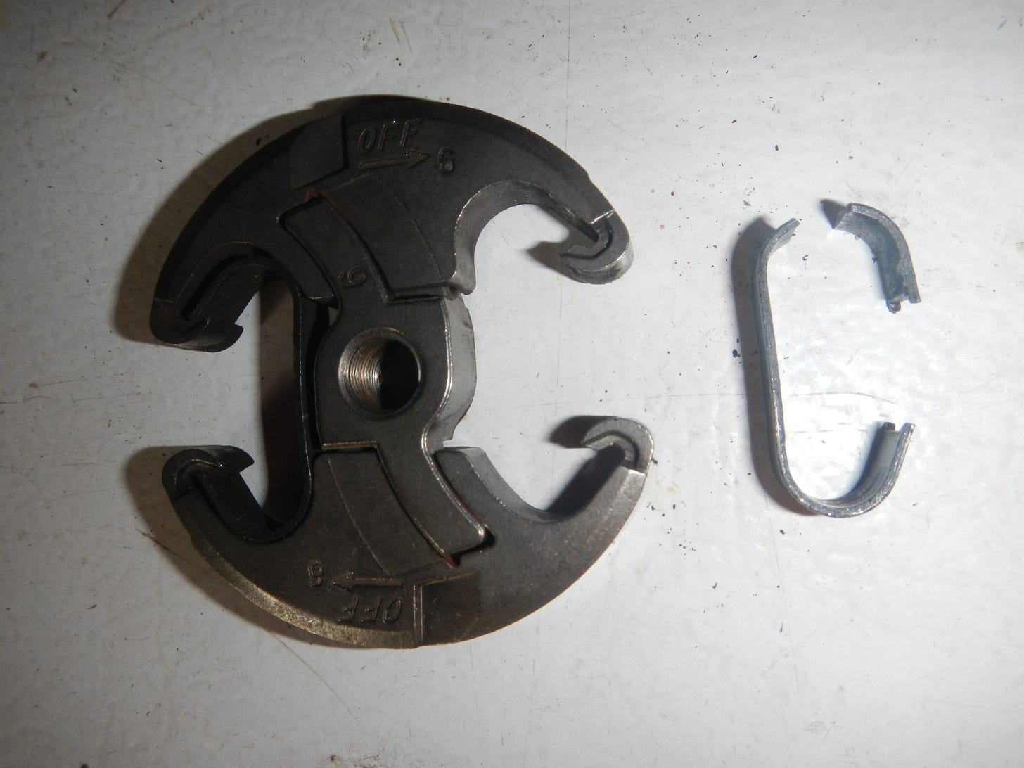 Broken chainsaw clutch; less than 8 hours on the new part
