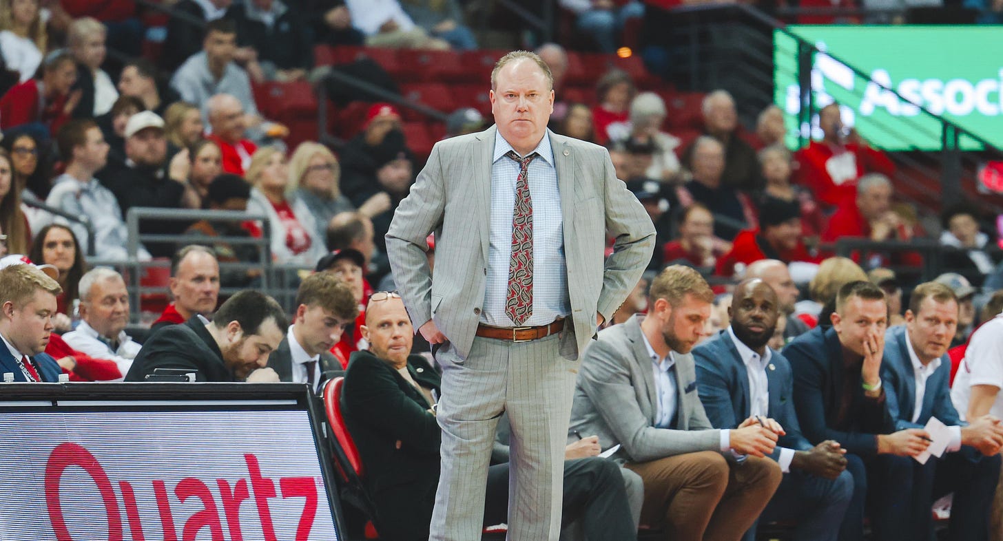 Wisconsin Badgers men's basketball head coach Greg Gard stands on the sideline during a game. Photo credit: Dane Sheehan.