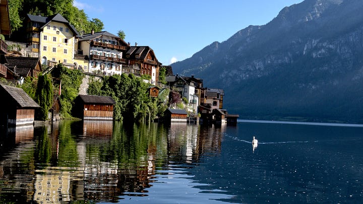 The series of images showcasing the beauty of Hallstatt in Austria from dawn to dusk.