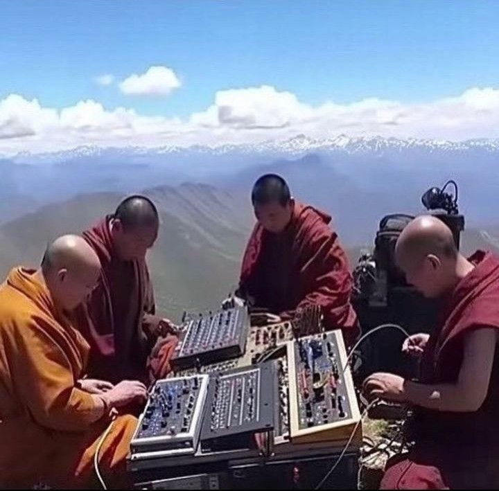 This may contain: three monks sitting on top of a mountain with sound equipment in their hands and looking at the camera