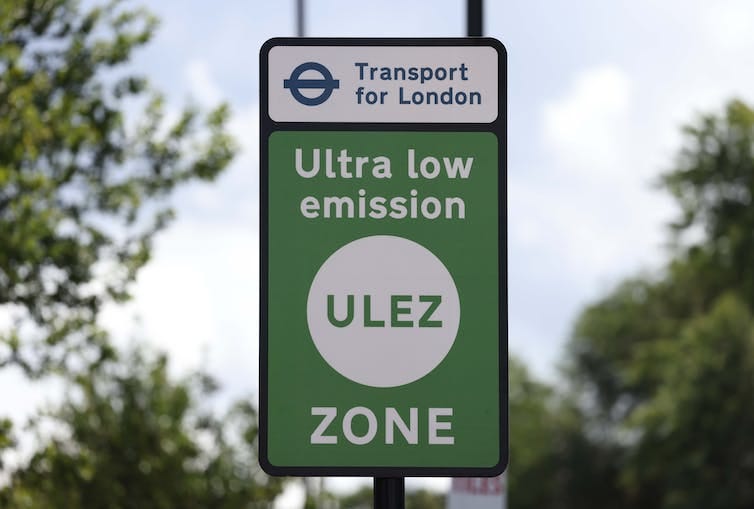A photo of a green traffic sign reading Transport for london, Ultra low emission zone, ULEZ A photo of a green traffic sign reading Transport for london, Ultra low emission zone, ULEZ