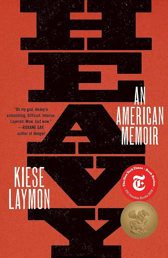 Cover image of Heavy: An American Memoir, by Kiese Laymon, with black text and a vibrant red background.