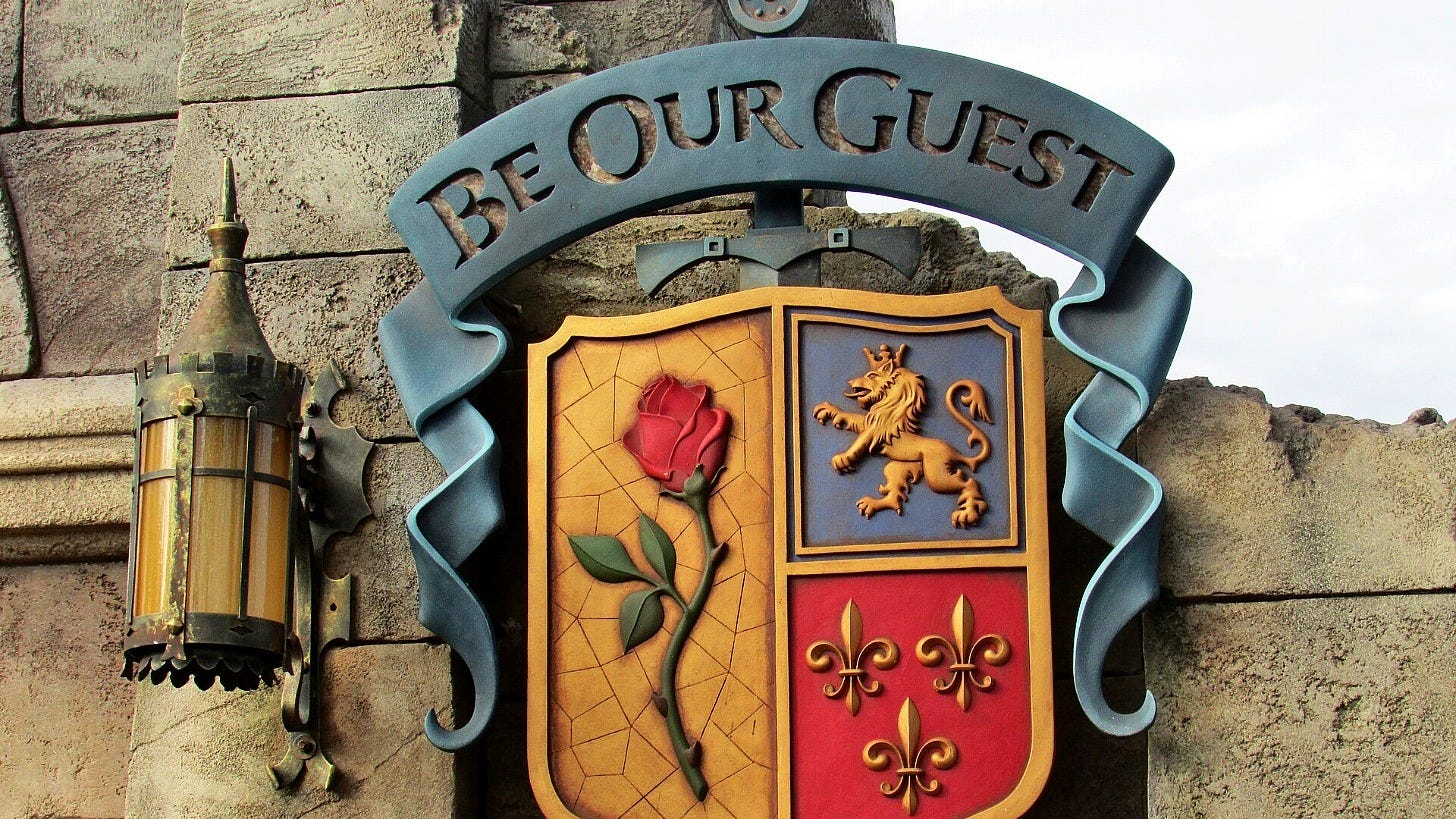 The Be Our Guest Restaurant sign at Magic Kingdom. Image: Tammy Young Heck via Wikimedia Commons The Be Our Guest Restaurant sign at Magic Kingdom. Image: Tammy Young Heck via Wikimedia Commons