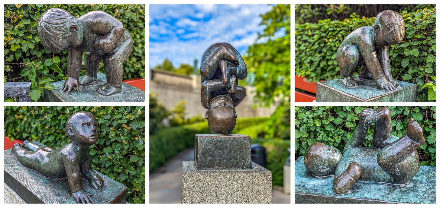 Sculptures of bronze babies rolling around, pushing themselves up and even standing on their head. 