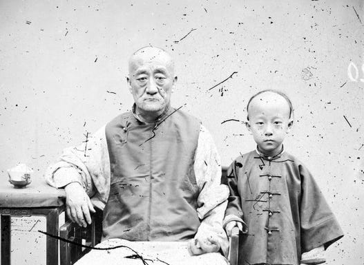 Photograph of an elderly man and young boy in 1869 Guangdong, used to reflect the global and human dimensions of integrating real history into storytelling projects. Photograph of an elderly man and young boy in 1869 Guangdong, used to reflect the global and human dimensions of integrating real history into storytelling projects.