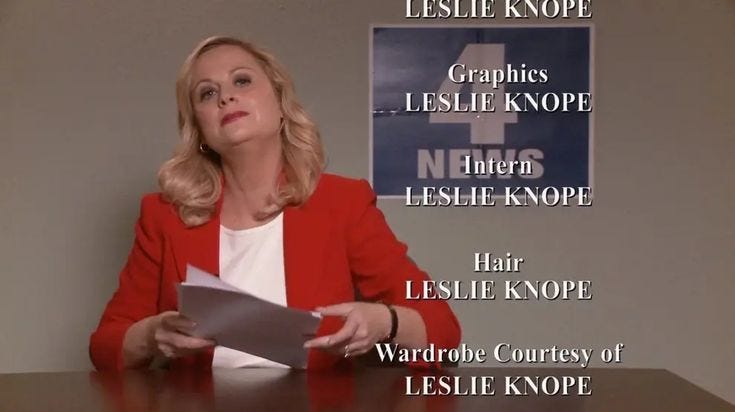 This may contain: a woman sitting at a table with a piece of paper in her hand This may contain: a woman sitting at a table with a piece of paper in her hand