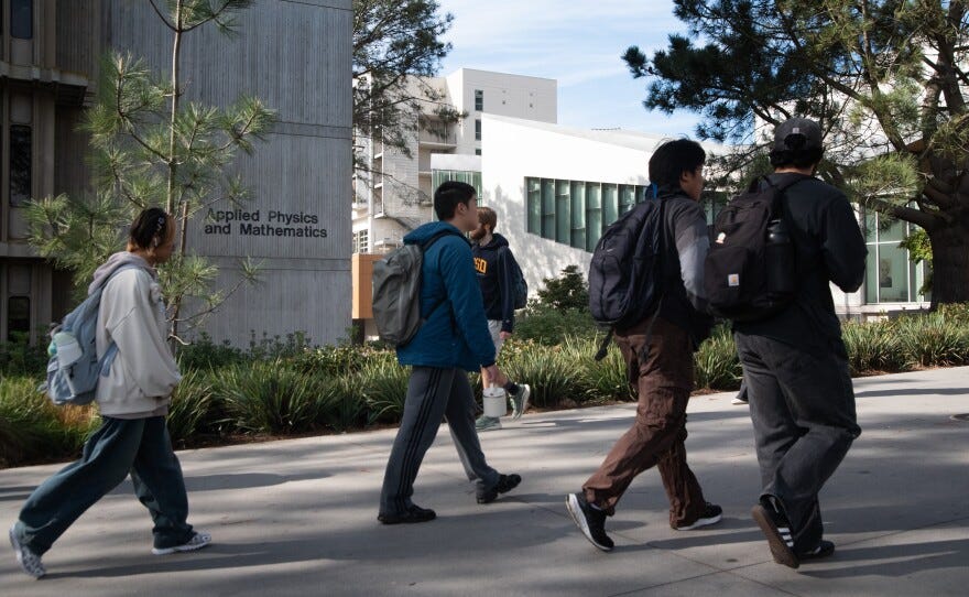 UCSD students walk past the Applied Physics and Mathematics building on campus in La Jolla on Nov. 24, 2025.