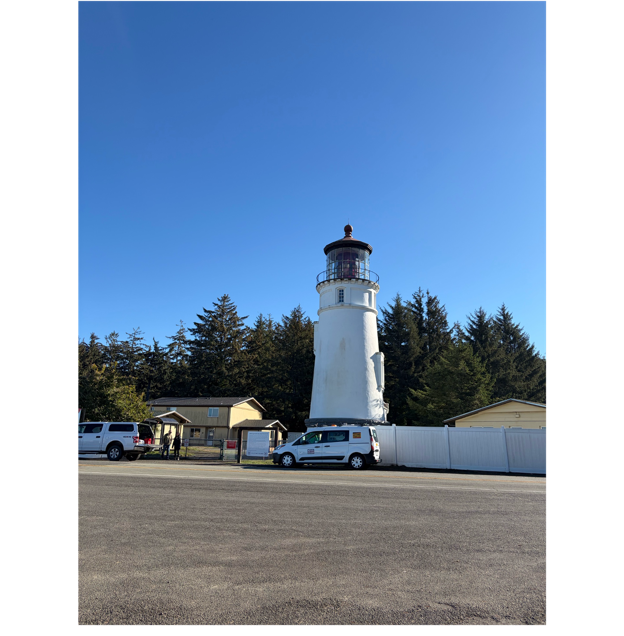 A white lighthouse with a truck parked in front of it

AI-generated content may be incorrect.