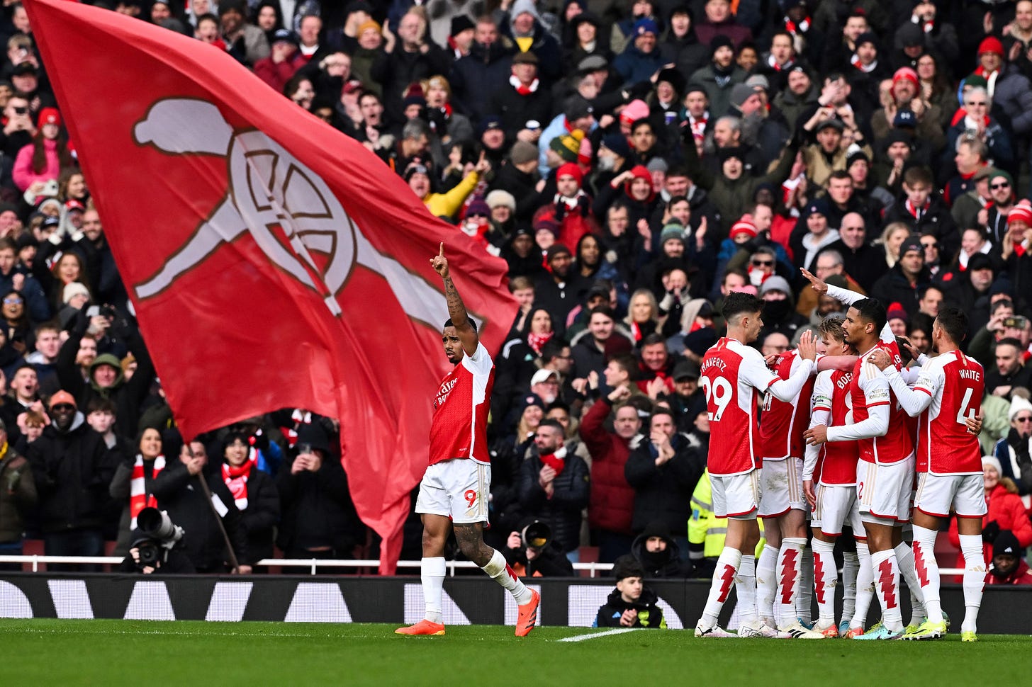 The Arsenal players celebrate after Leandro Trossard's goal.