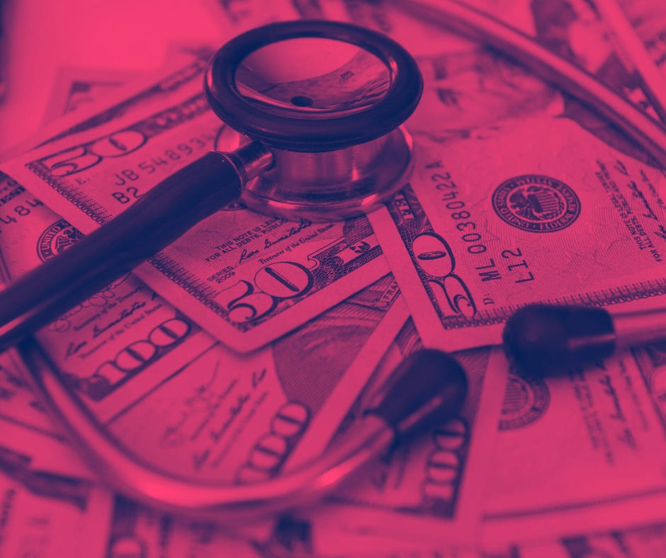 Image shows a doctor's stethoscope on top of a pile of money. The image is tinted red.