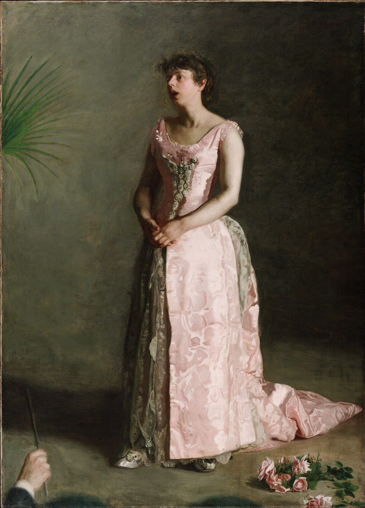 A woman in a pink gown singing an aria, hand lifted A woman in a pink gown singing an aria, hand lifted