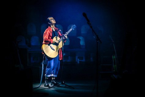 A series of images from Manic Street Creature, where Maimuna plays guitar on stage