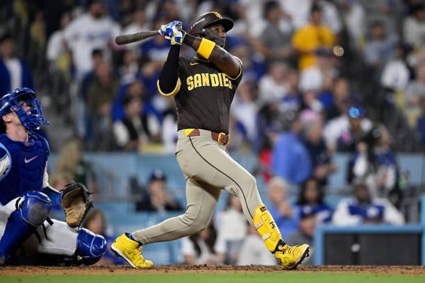 Jurickson Profar of the San Diego Padres flies out in the eighth inning against the Los Angeles Dodgers during Game Two of the Division Series at...