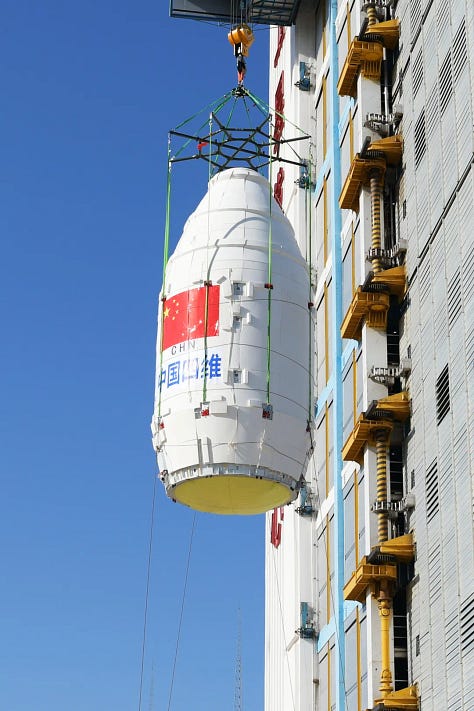 The Long March 2D's fairing and first-stage heading to and being placed onto Launch Complex 9.