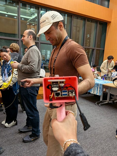 Photos of people around projectors and augmented pieces of paper from the Folk studio