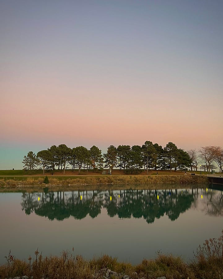 Left: A quiet lakeside landscape at sunset with trees mirrored in the water. Right: A modern business school atrium with natural light and students gathered throughout the space.