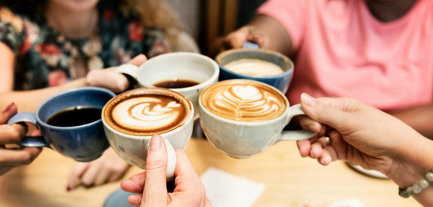 5 coffee mugs raised in a toast between friends 5 coffee mugs raised in a toast between friends