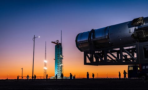 LandSpace's Zhuque-3 Y1 vehicle heading to the launch pad and recieving its payload fairing.