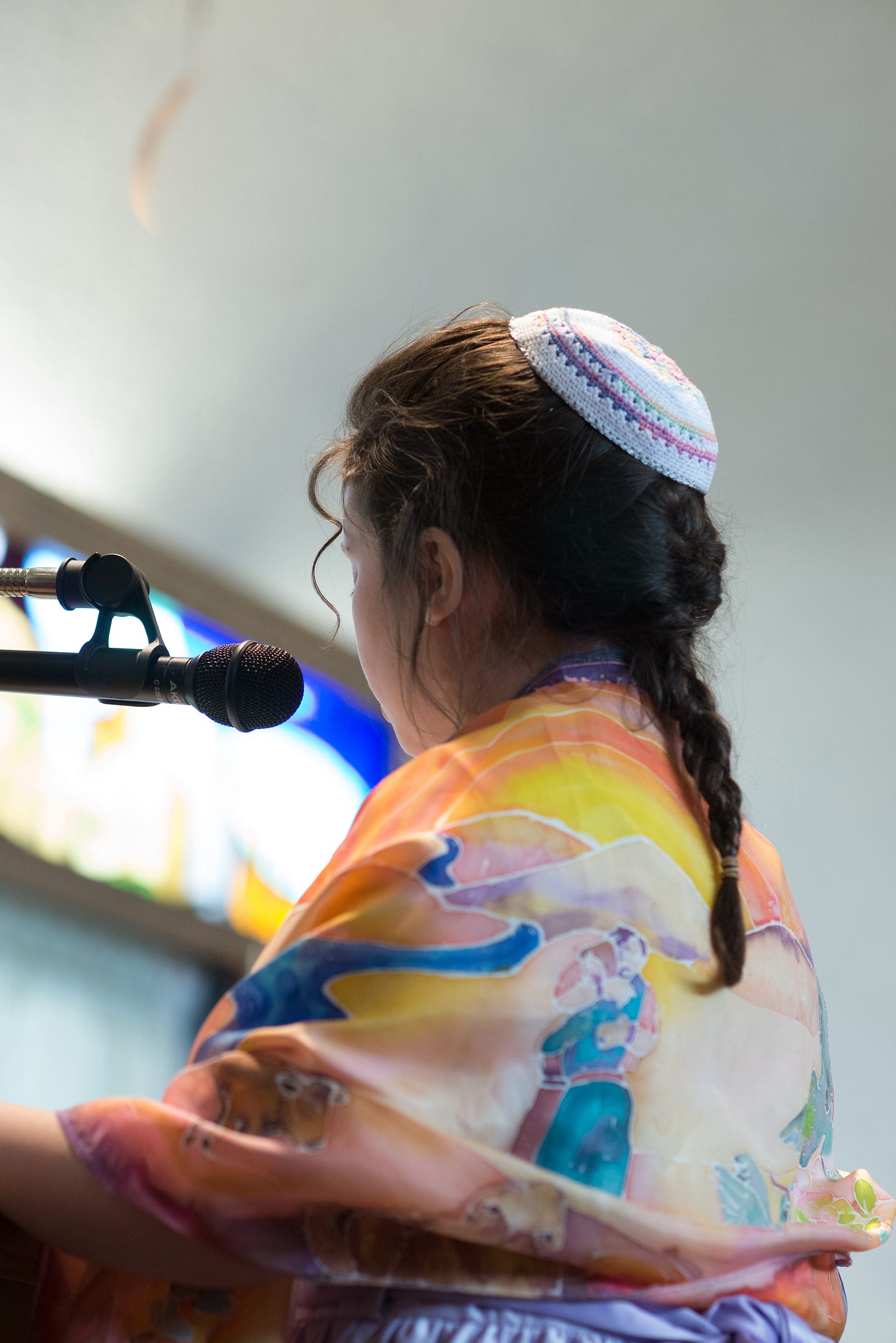 12 y/o Shira from the back, with tallit showing the brothers embracing