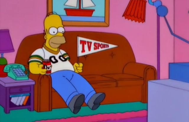 Homer on couch with "TV Sports" pennant" Homer on couch with "TV Sports" pennant"