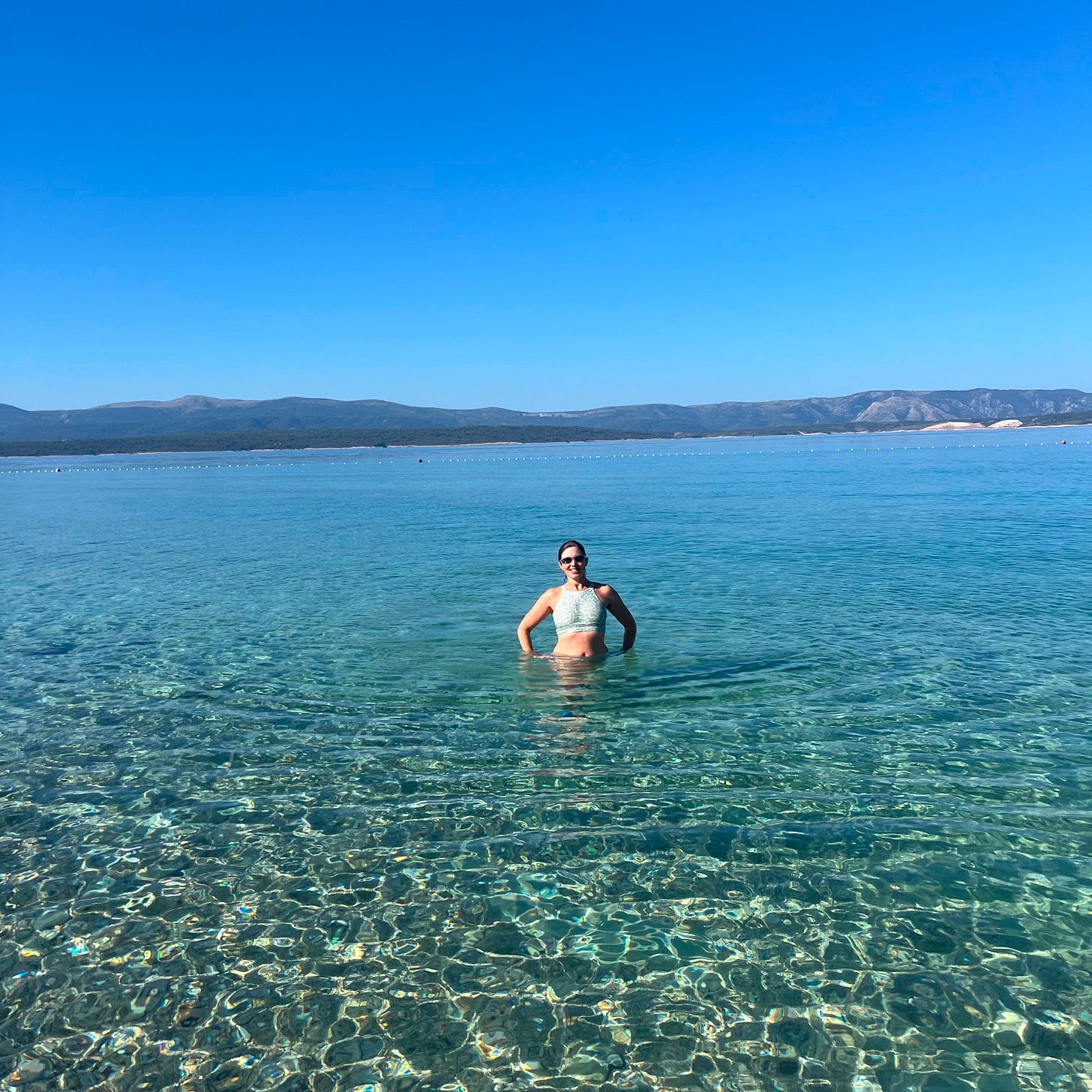 a woman standing in the Adriatic Sea a woman standing in the Adriatic Sea
