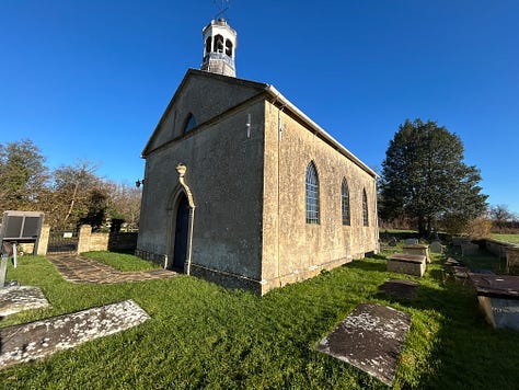 Photos of the stone built St Giles Church. A close of of the entrance doorway, and there are some graves in the small garden which is walled in stone. Photos: Roland Millward
