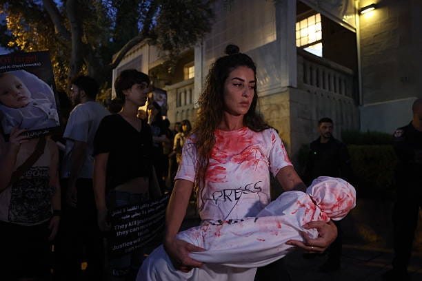 People carrying banners along with photographs of their relatives. Gather to demand an end to the famine in Gaza and protest against Israeli forces...