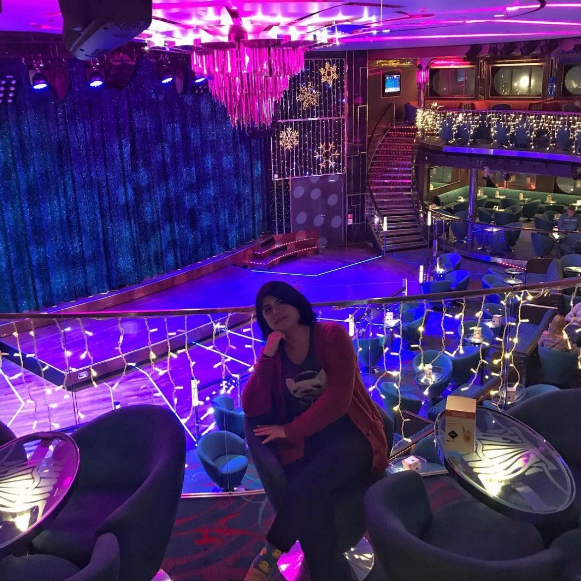 Me seated at at the empty casino of our Estonian cruise