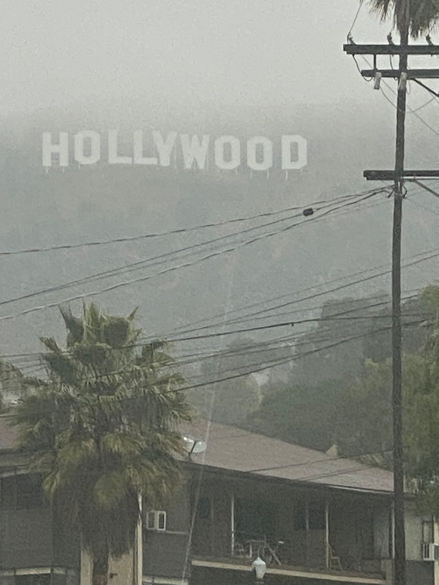 A picture containing text, outdoor, street, town

Description automatically generated