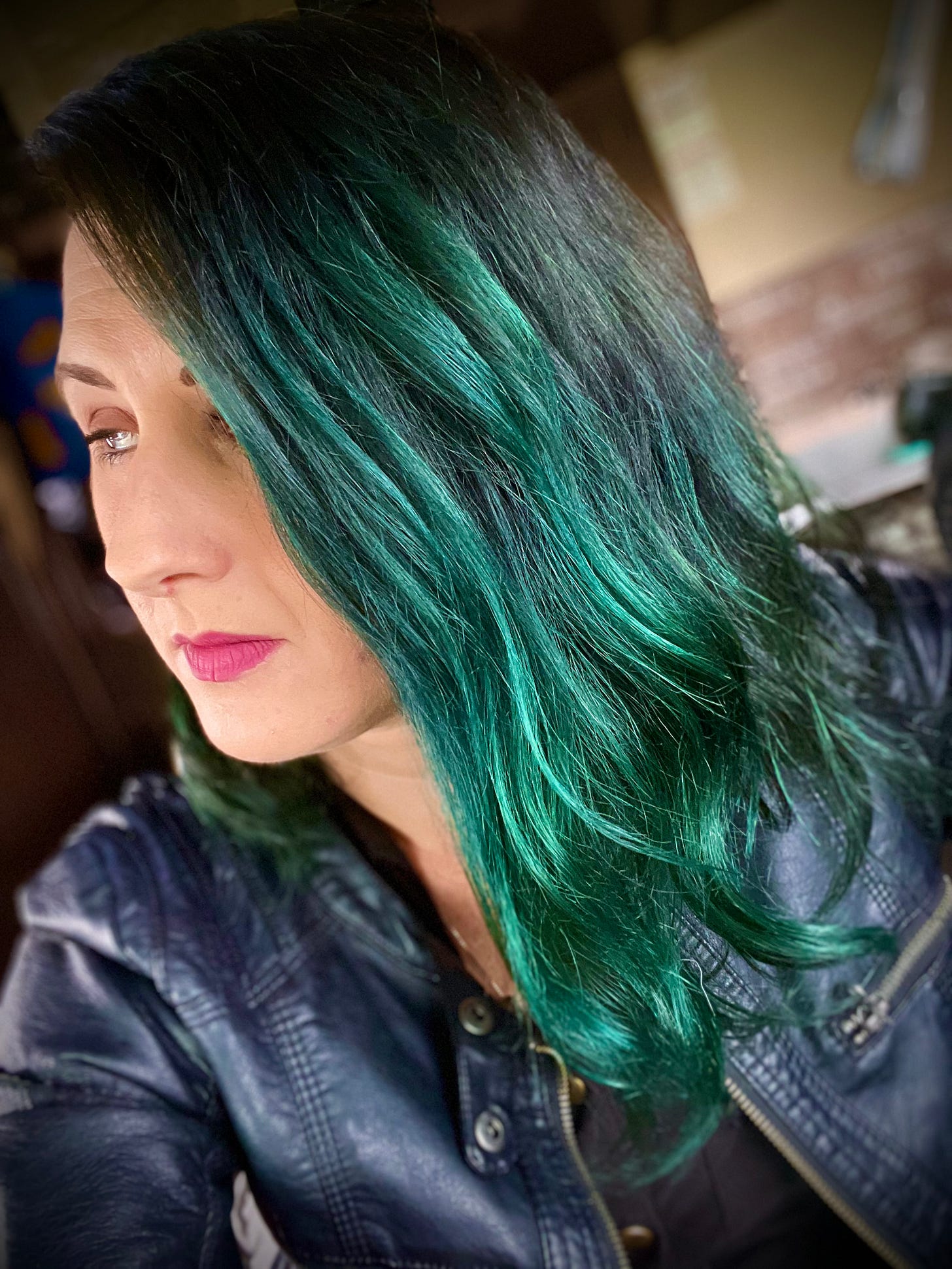 Lyric, last year, deep in depression, with green hair and a black leather jacket.