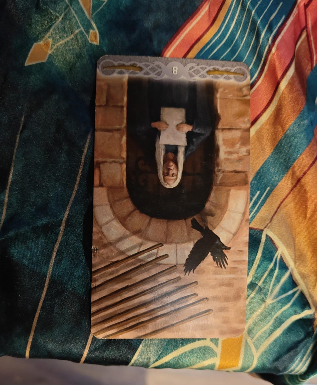 The Eight of Wands tarot card in the reversed position The Eight of Wands tarot card in the reversed position