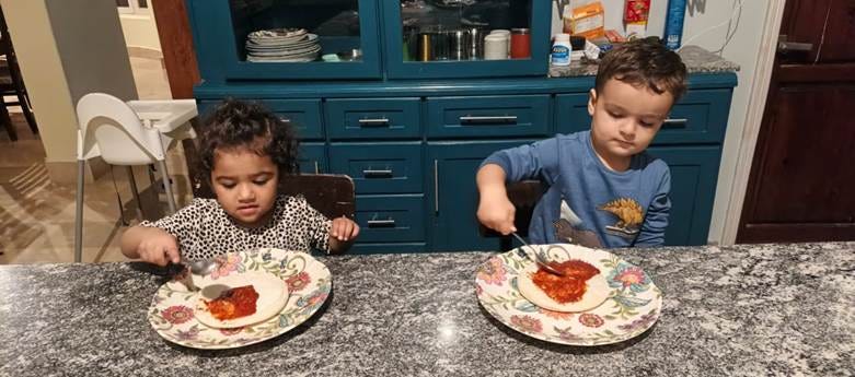 Silas and Maggie's first time making pizza!