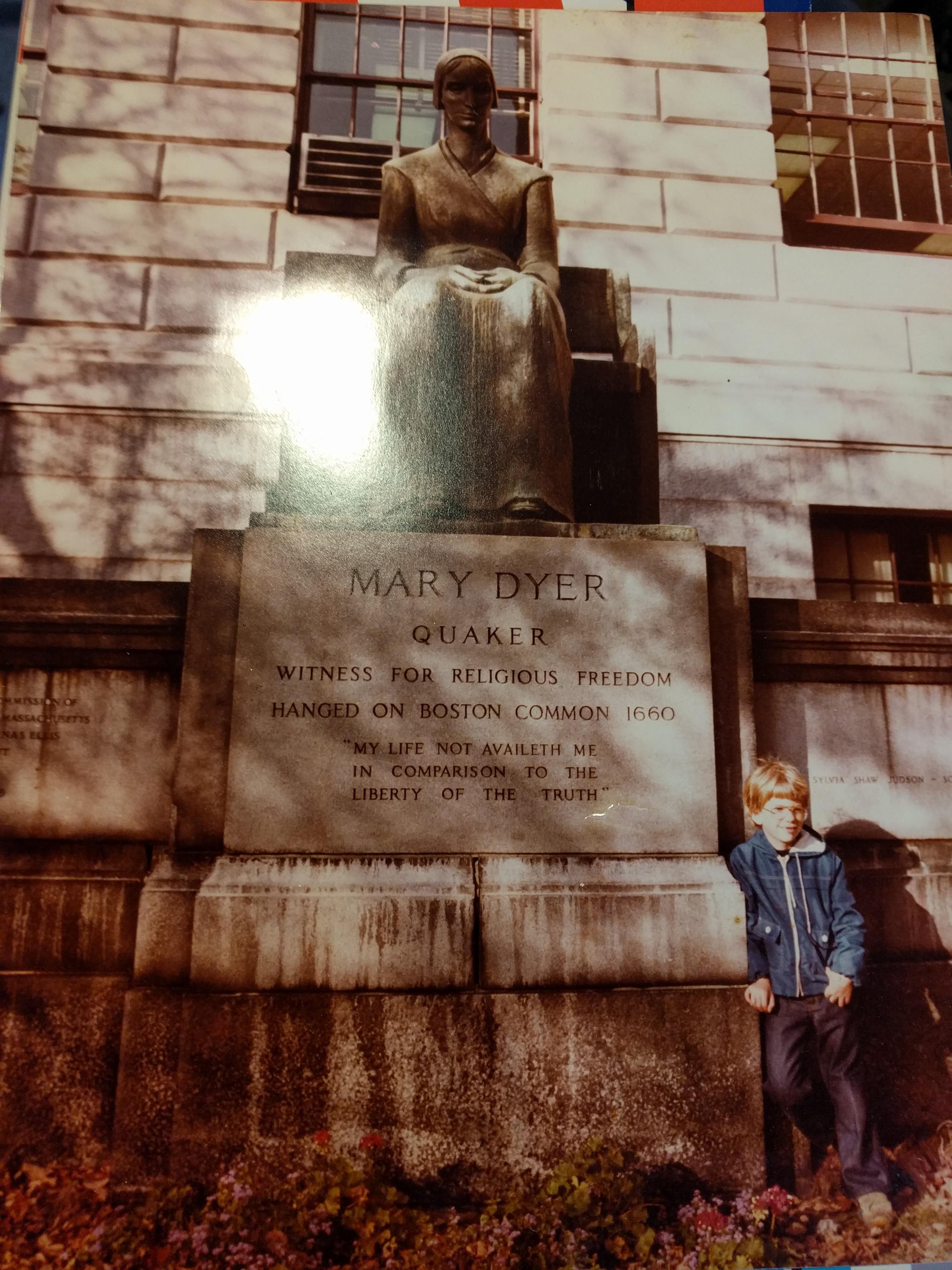 A statue of Mary Dyer with a very young Moriko standing next to it. 