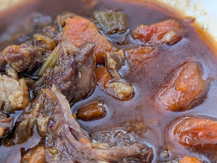 Braised beef and oxtail with veggies.