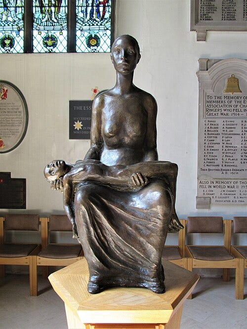 A statue of a person holding a baby

AI-generated content may be incorrect.