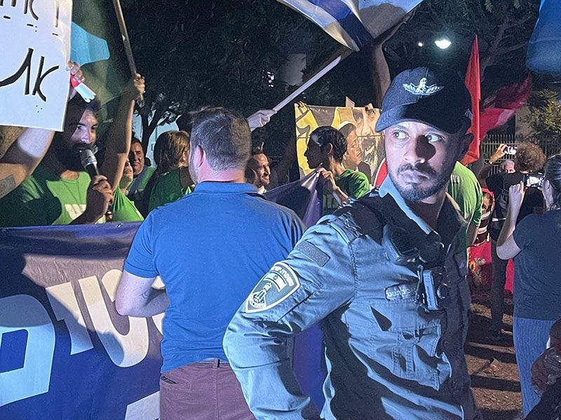 An Israeli police officer keeps a watchful eye on the crowd as Ben Gvir arrives. (Photo by Vivian Bercovic) An Israeli police officer keeps a watchful eye on the crowd as Ben Gvir arrives. (Photo by Vivian Bercovic)