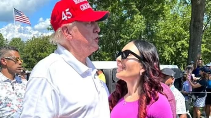 US President Donald Trump with Laura Loomer. 
