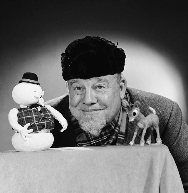 Behind the scenes photo of actor and folk-singer Burl Ives posing with Sam the Snowman and Rudolph the Red-nosed Reindeer puppets. Taken before the premiere of the Rankin/Bass Christmas Special on NBC. ( Behind the scenes photo of actor and folk-singer Burl Ives posing with Sam the Snowman and Rudolph the Red-nosed Reindeer puppets. Taken before the premiere of the Rankin/Bass Christmas Special on NBC. (