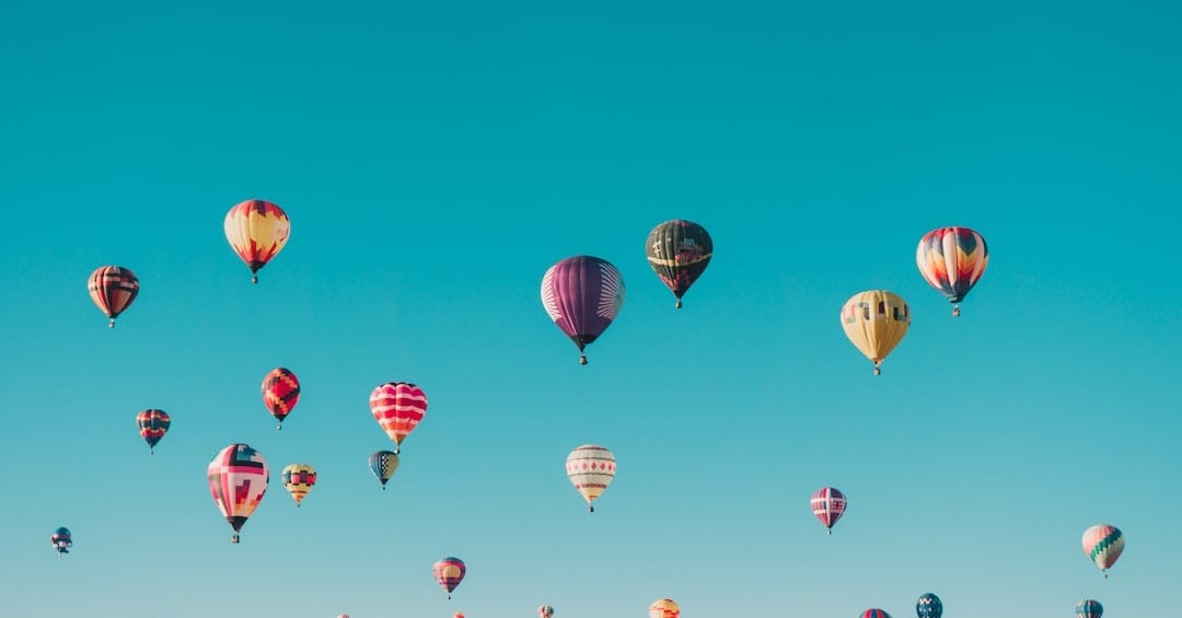 assorted-color hot air balloons during daytime assorted-color hot air balloons during daytime