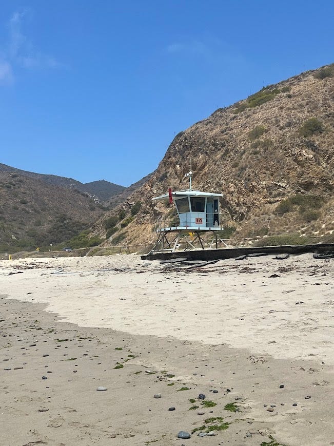 Lifeguard stand with mountains in the background.