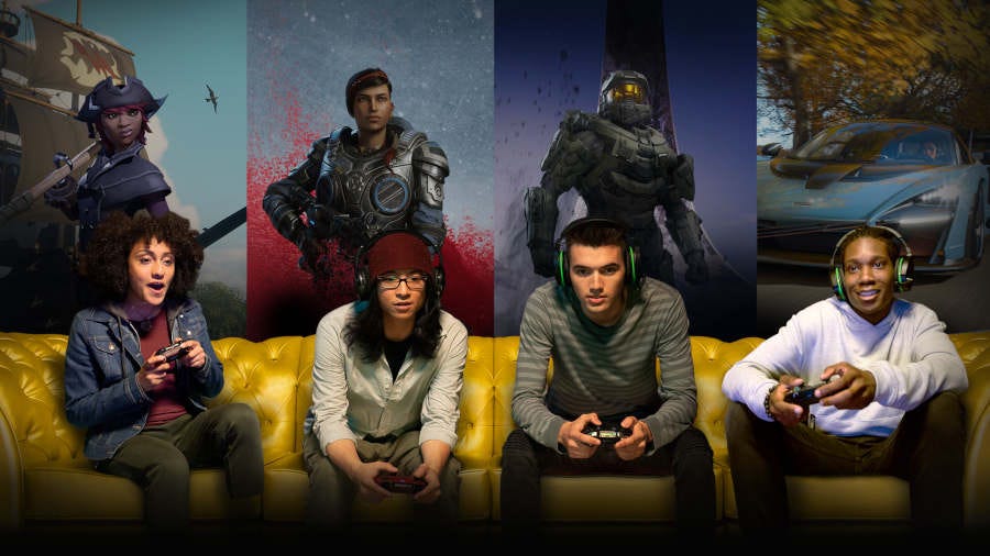 Four people sitting on a sofa playing Xbox