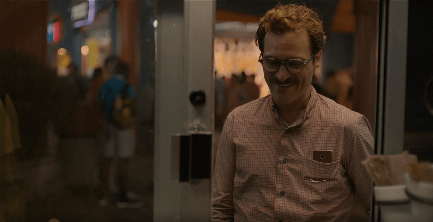 In the Movie "Her", there is a pin keeping the shirt pocket closed off so that the camera can see out of the pocket allowing the AI Samantha a view of the In the Movie "Her", there is a pin keeping the shirt pocket closed off so that the camera can see out of the pocket allowing the AI Samantha a view of the