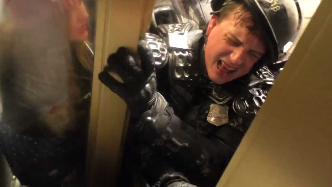 A screenshot of a video showing D.C. Metropolitan police officer Daniel Hodges being attacked at the Capitol on Jan. 6, 2021.
