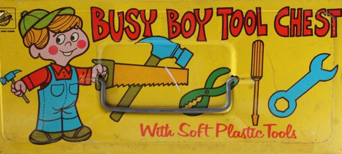 illustrations on the lid of a vintage child's toy toolbox; a drawing of a little blond boy in overalls and the text "busy boy tool box with soft plastic tools""