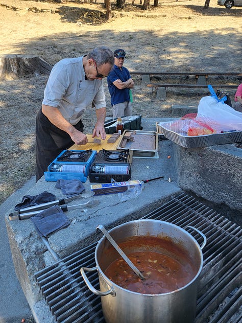 picture of a woman on horseback reading; a woman dressed Deco reading, and a man making food in an outdoor kitchen