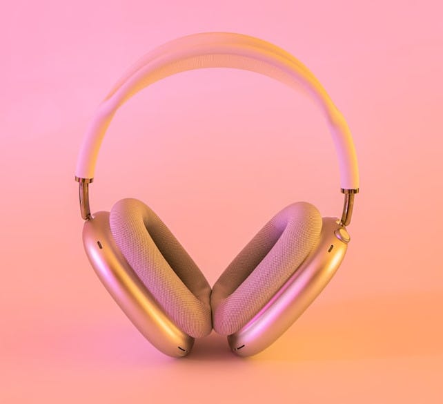 pink and white wireless headphones