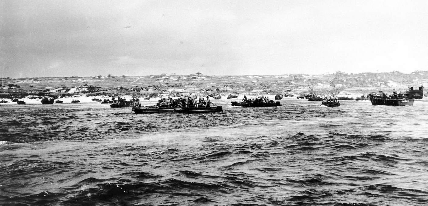 The sixth wave of Marines move into Green Beach 2 on Okinawa. From the Norm Hatch collection of the National Museum of the Pacific War. The sixth wave of Marines move into Green Beach 2 on Okinawa. From the Norm Hatch collection of the National Museum of the Pacific War.
