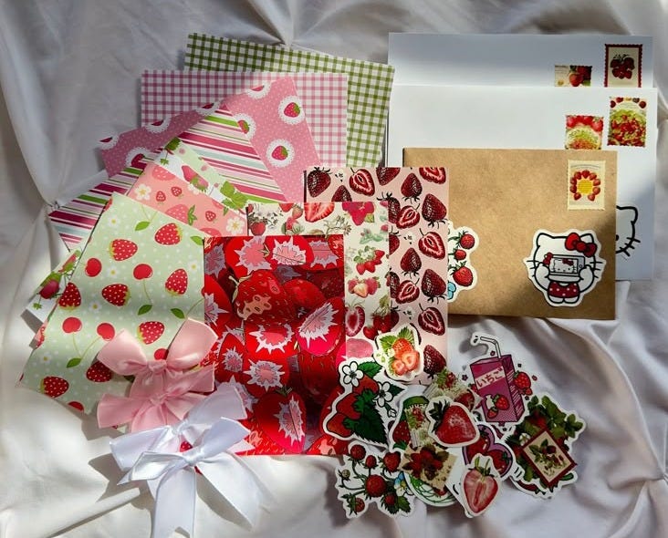 This may contain: several different types of paper and stickers on a sheet with white sheets in the background